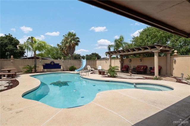 2820 Joan Dr, Edinburg, TX 78541 - view of pool with a water slide, a patio, a fenced backyard, and a pergola