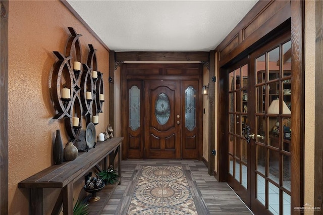 2820 Joan Dr, Edinburg, TX 78541 - entrance foyer featuring a textured wall, wood finished floors, and french doors