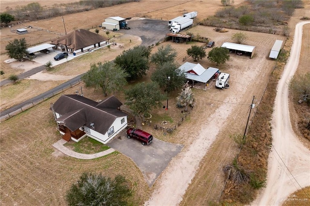 birds eye view of property featuring a rural view