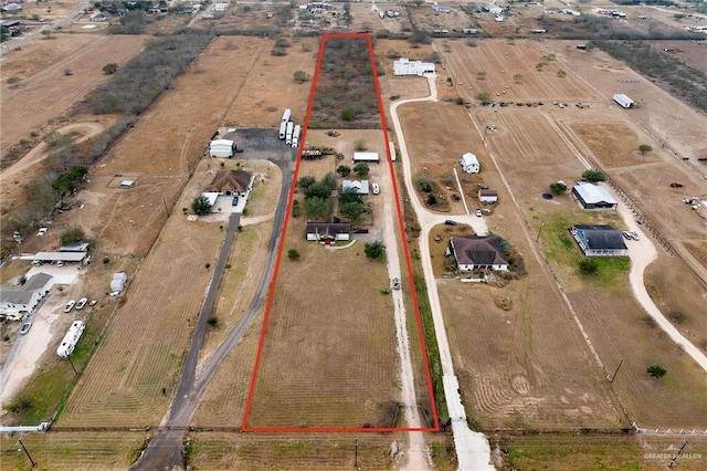 birds eye view of property featuring a rural view