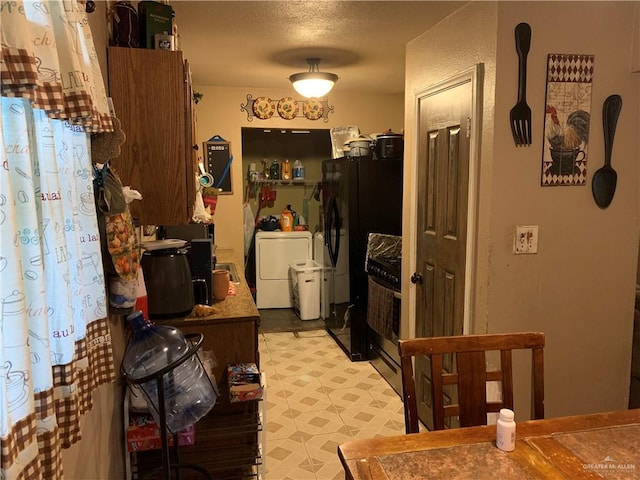 interior space with washing machine and clothes dryer and light floors