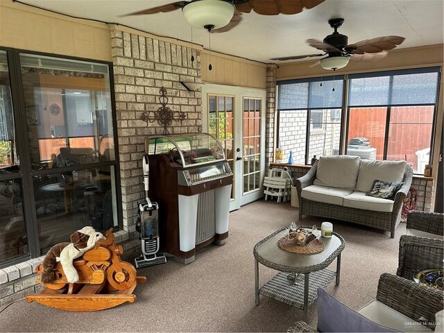42 E Cherokee Dr, Harlingen, TX 78550 - carpeted living area with a ceiling fan