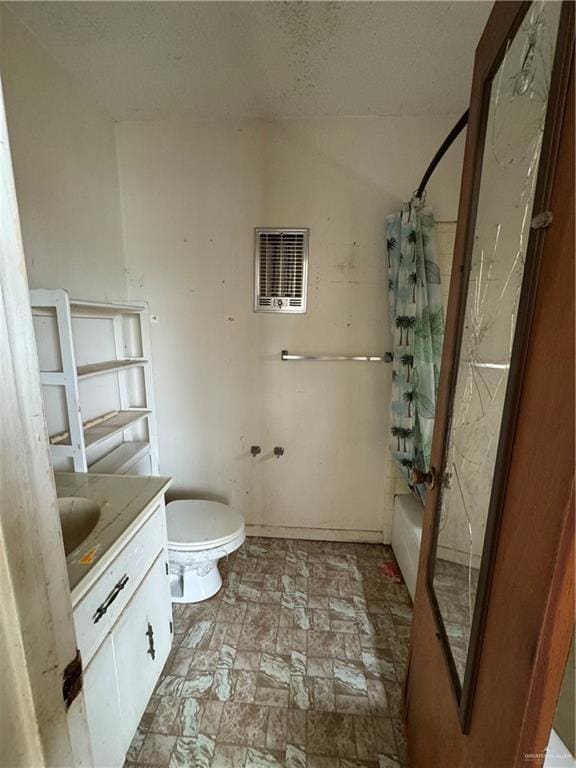 full bathroom featuring vanity, shower / bathtub combination with curtain, and toilet