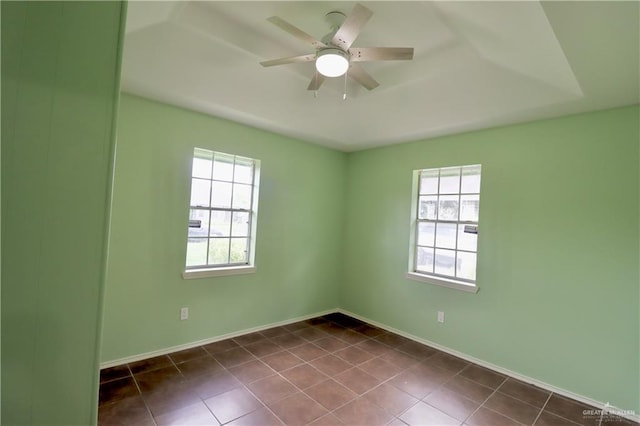 113 W Garfield Ave, San Juan, TX 78589 - unfurnished room with plenty of natural light, dark tile patterned floors, and a ceiling fan