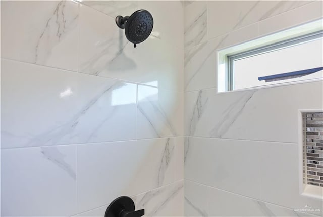 details with a tile shower