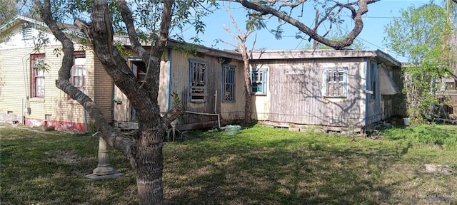 view of home's exterior featuring crawl space and a yard