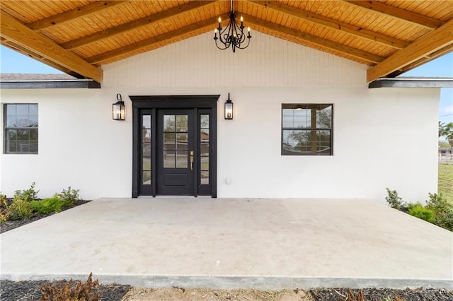 doorway to property with stucco siding