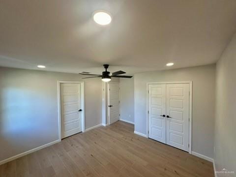 unfurnished bedroom with a closet, ceiling fan, and light hardwood / wood-style flooring