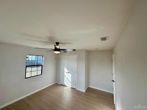 unfurnished bedroom with hardwood / wood-style flooring and ceiling fan