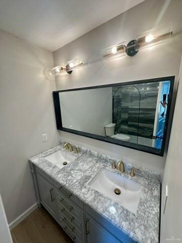 bathroom featuring vanity and hardwood / wood-style flooring