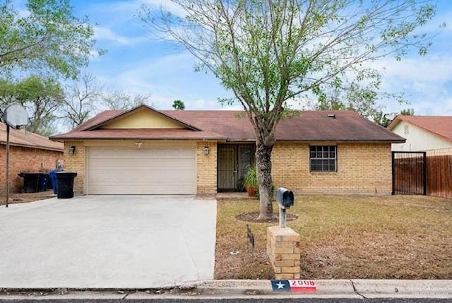 single story home with a front lawn and a garage