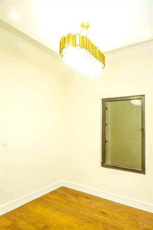 empty room featuring hardwood / wood-style floors