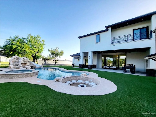 view of pool with a lawn, an outdoor hangout area, an in ground hot tub, and a patio