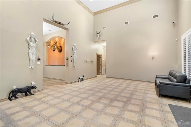 4004 Persimmon Dr, Palmhurst, TX 78573 - building lobby with a high ceiling and crown molding