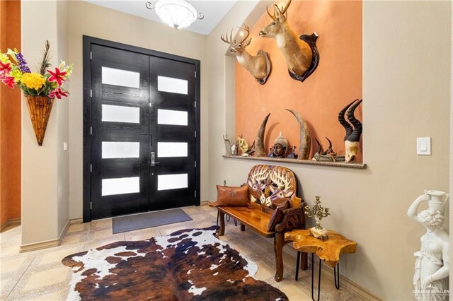 4004 Persimmon Dr, Palmhurst, TX 78573 - foyer entrance featuring baseboards and french doors