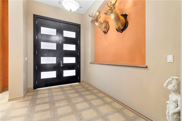 4004 Persimmon Dr, Palmhurst, TX 78573 - entryway featuring french doors and baseboards