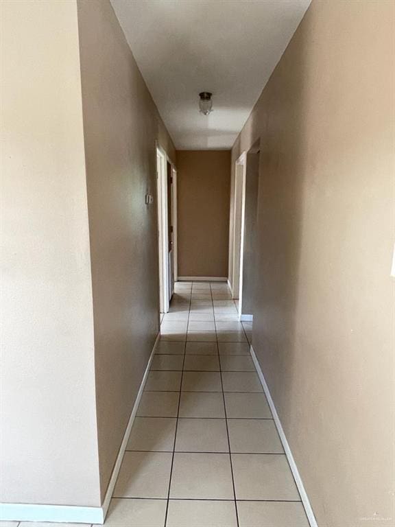 1017 El Recreo Cir, Edinburg, TX 78539 - hall featuring light tile patterned floors and baseboards