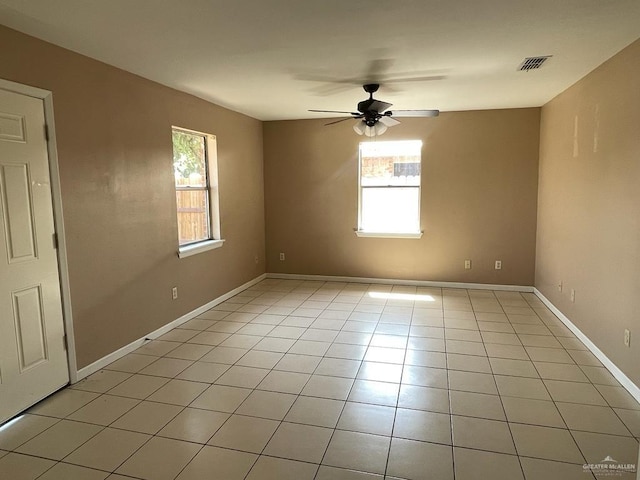1017 El Recreo Cir, Edinburg, TX 78539 - spare room with plenty of natural light, ceiling fan, and light tile patterned flooring