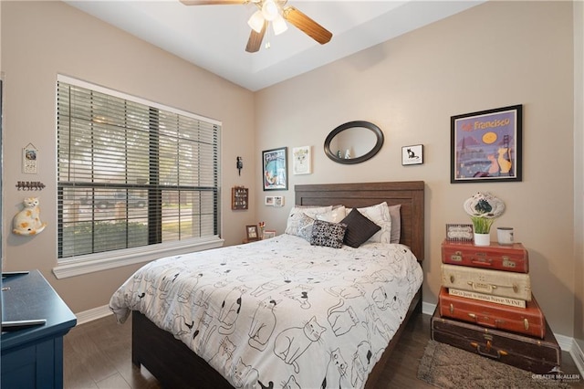 bedroom featuring dark hardwood / wood-style floors and ceiling fan