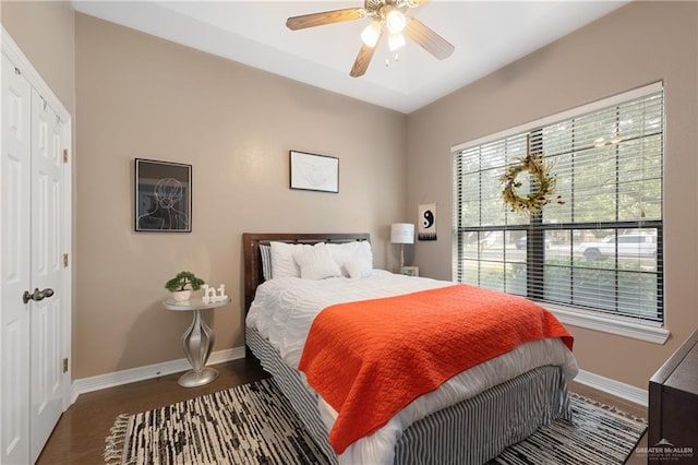 bedroom featuring hardwood / wood-style flooring, a closet, and ceiling fan