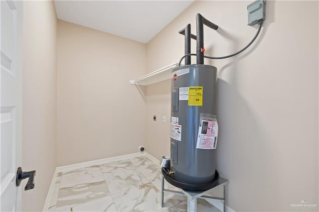 727 N Milam St, San Benito, TX 78586 - utility room featuring water heater