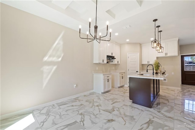 727 N Milam St, San Benito, TX 78586 - kitchen with a sink, a chandelier, light marble finish floors, baseboards, and recessed lighting