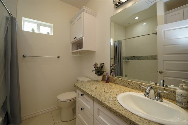 bathroom with tile patterned floors, toilet, curtained shower, and vanity