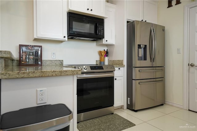 kitchen featuring white cabinetry, light stone counters, and appliances with stainless steel finishes