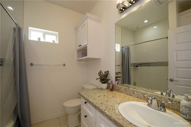 bathroom featuring vanity, toilet, curtained shower, and tile patterned flooring