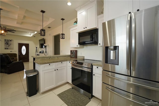 kitchen with white cabinetry, hanging light fixtures, dark stone countertops, stainless steel appliances, and kitchen peninsula