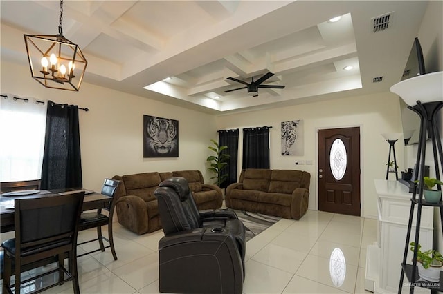 living room with beamed ceiling, light tile patterned flooring, coffered ceiling, and ceiling fan with notable chandelier