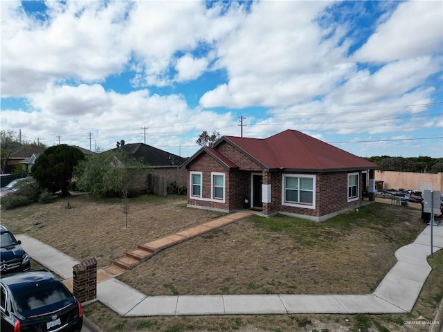 ranch-style house with a front yard