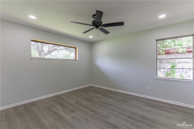 unfurnished room featuring hardwood / wood-style floors and ceiling fan