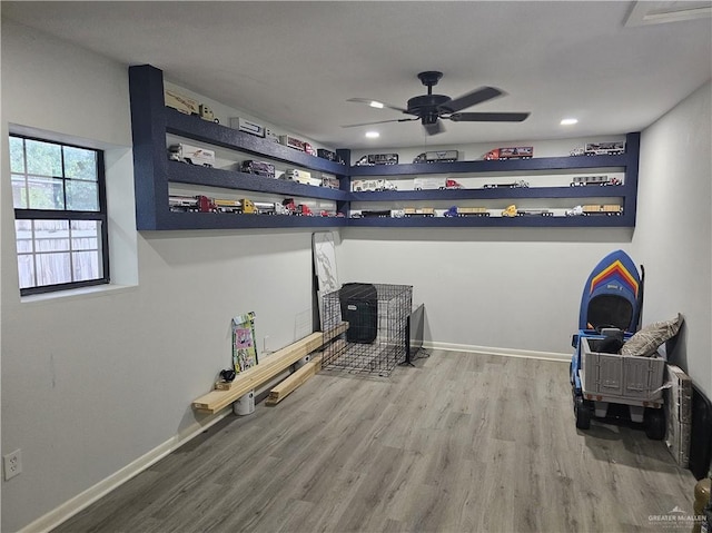 bedroom with ceiling fan and wood-type flooring