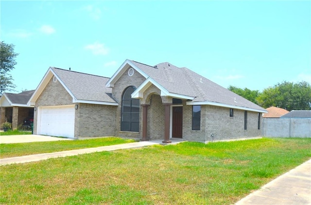 3107 E Laurel St, Hidalgo, TX 78557 - single story home with brick siding, a garage, driveway, and roof with shingles
