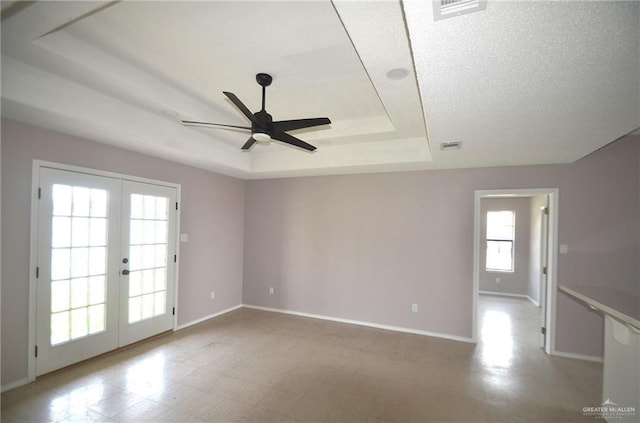 3107 E Laurel St, Hidalgo, TX 78557 - unfurnished room featuring a tray ceiling, french doors, a ceiling fan, and baseboards