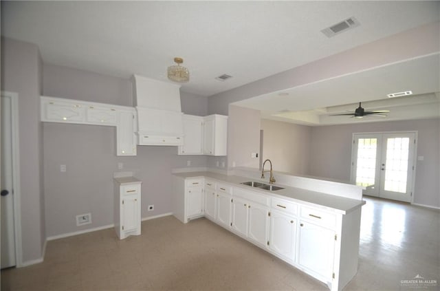 3107 E Laurel St, Hidalgo, TX 78557 - kitchen with a sink, a peninsula, light floors, and baseboards