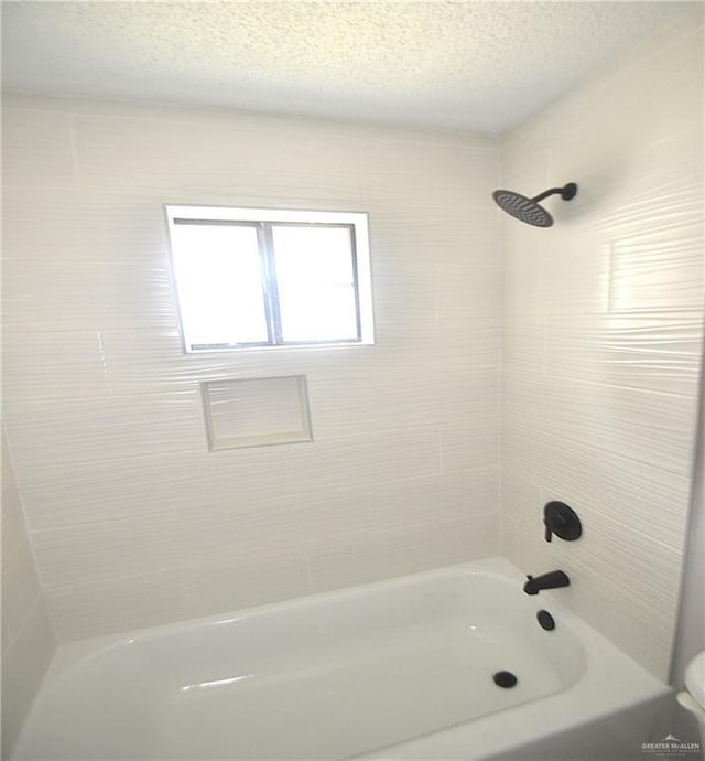 3107 E Laurel St, Hidalgo, TX 78557 - full bathroom with a textured ceiling and  shower combination