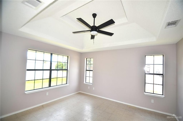 3107 E Laurel St, Hidalgo, TX 78557 - spare room with a raised ceiling, baseboards, and a ceiling fan