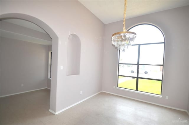 3107 E Laurel St, Hidalgo, TX 78557 - unfurnished room with plenty of natural light, a chandelier, baseboards, and arched walkways