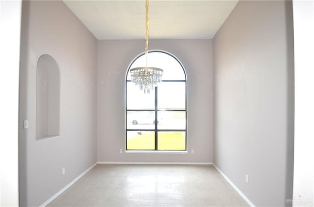 3107 E Laurel St, Hidalgo, TX 78557 - unfurnished room featuring a chandelier and baseboards