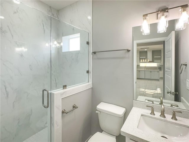 2025 Trinity St, Donna, TX 78537 - bathroom featuring a marble finish shower, vanity, and toilet