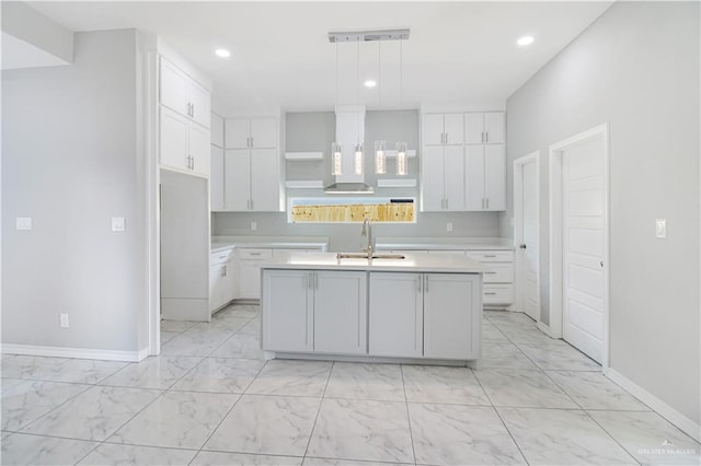 2025 Trinity St, Donna, TX 78537 - kitchen featuring light marble finish floors, a sink, wall chimney exhaust hood, open shelves, and recessed lighting