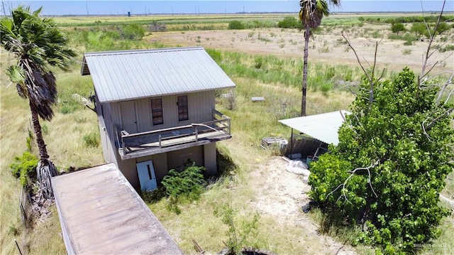 birds eye view of property featuring a rural view