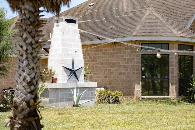 view of home's exterior with a yard