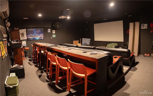 home theater room featuring light colored carpet