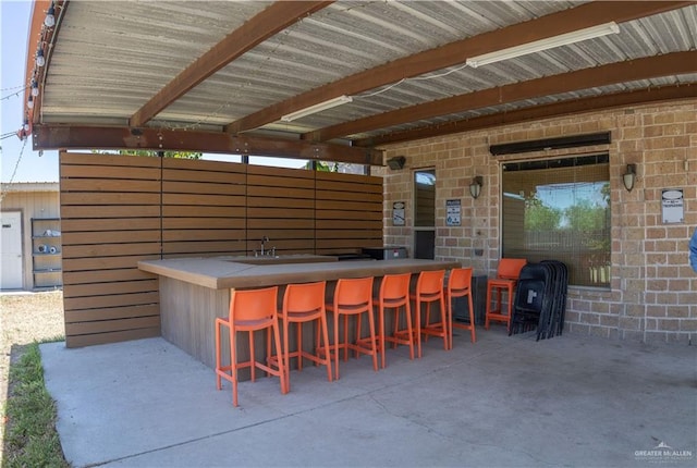 view of patio / terrace featuring exterior bar