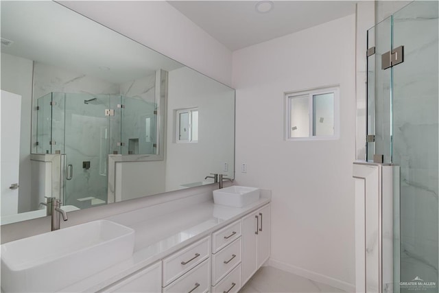 2711 Harmony St, Mission, TX 78574 - bathroom with a sink, a marble finish shower, and marble finish floor