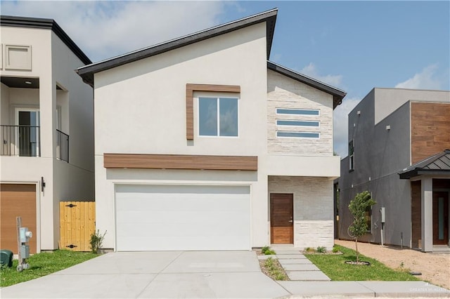 2711 Harmony St, Mission, TX 78574 - contemporary home featuring a garage, stucco siding, stone siding, and concrete driveway