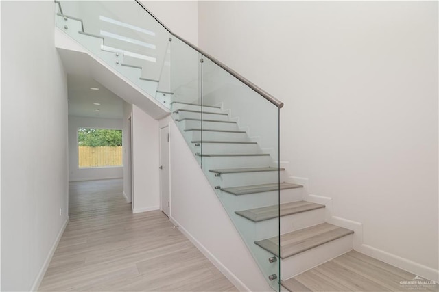 2711 Harmony St, Mission, TX 78574 - stairway with baseboards and wood finished floors